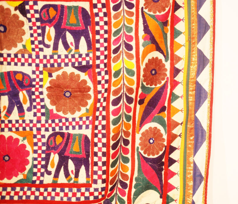 Vintage textile wall hanging with elephants
