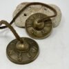 Traditional Tingsha meditation chimes with dragon symbols